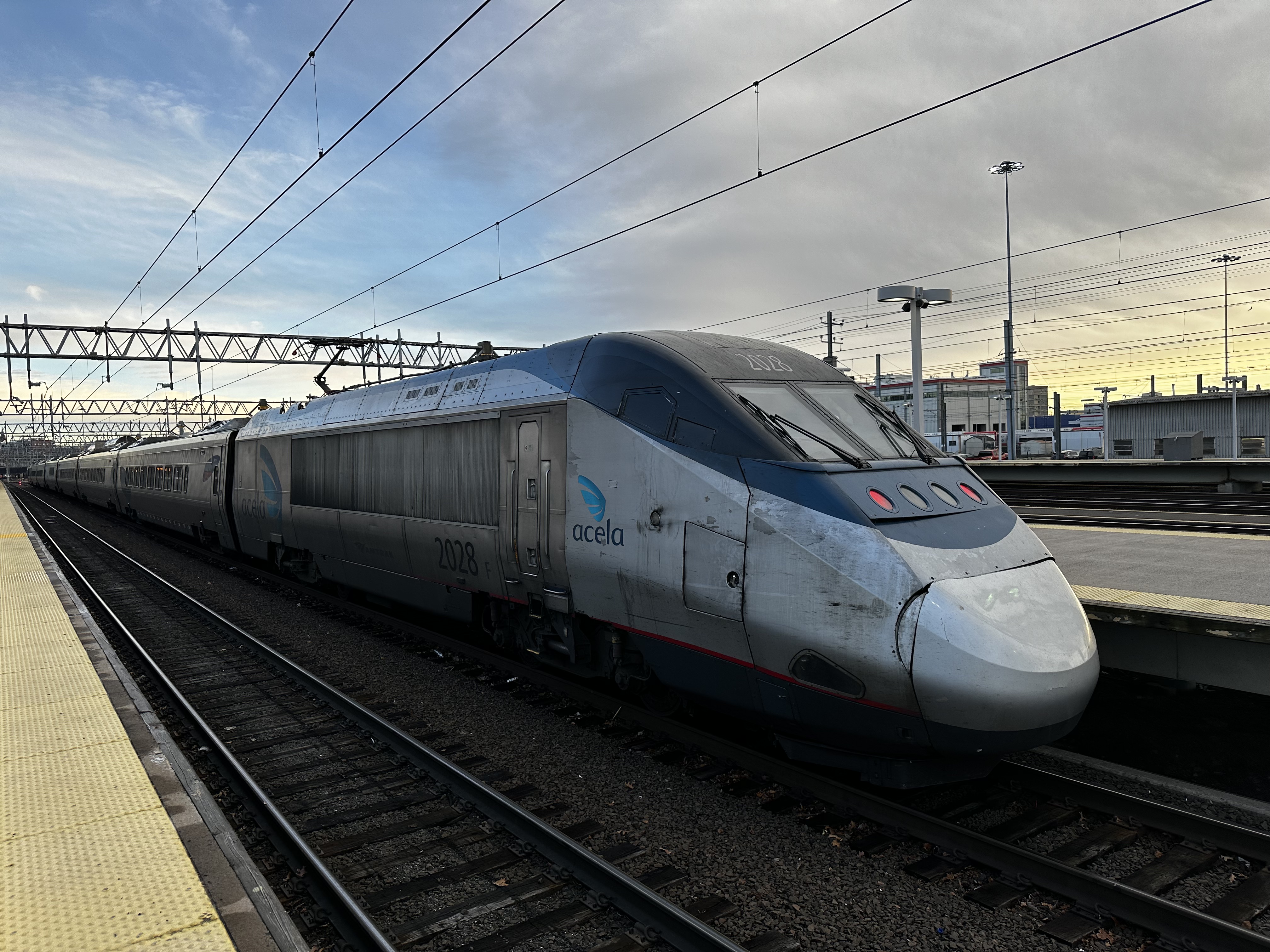 An Amtrak Acela Express trainset sits at a platform in New Haven, CT
