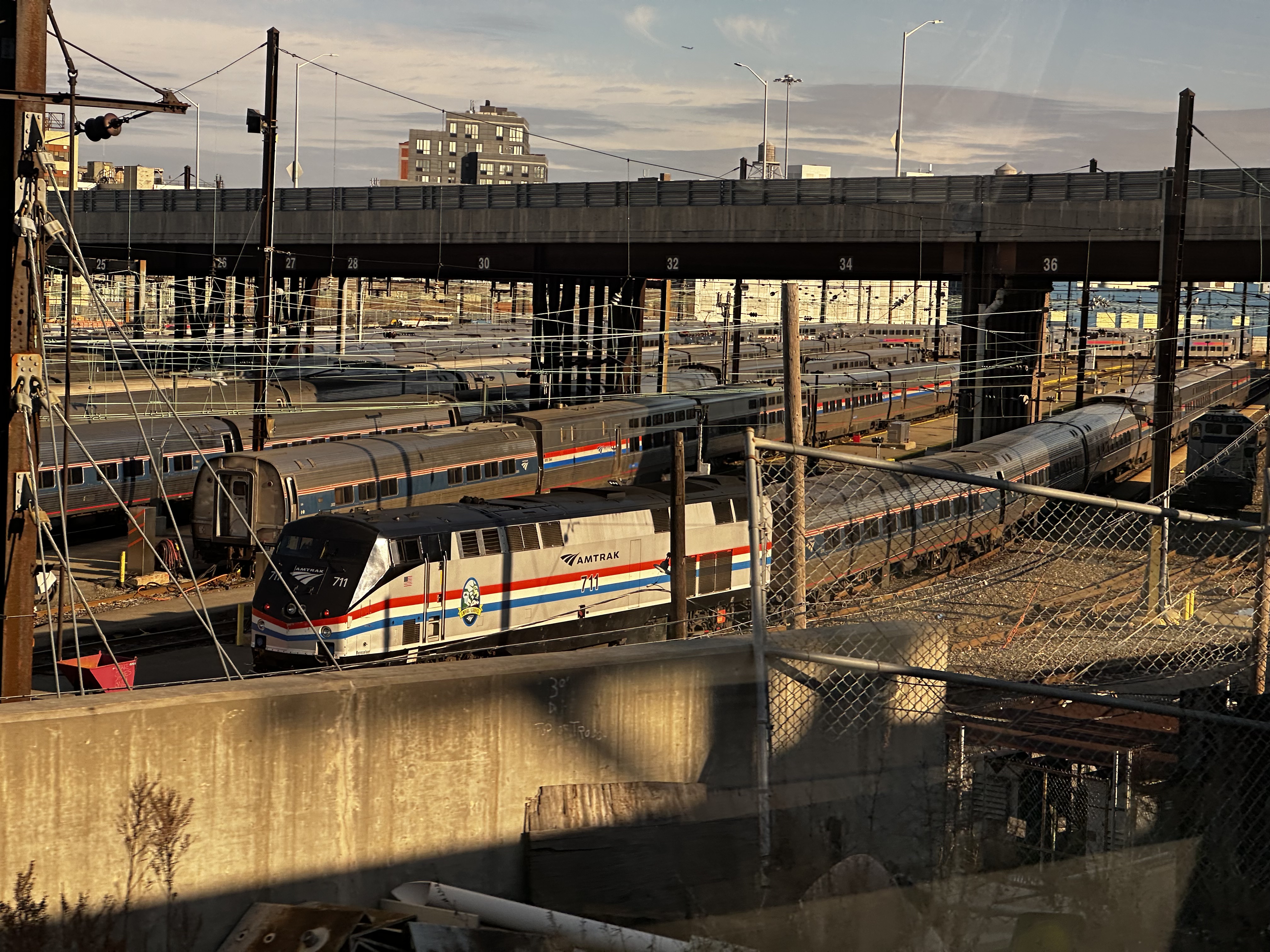 An Amtrak Empire Corridor trainset prepares to depart for Penn Station from Sunnyside Yard in Queens, 
            NY.